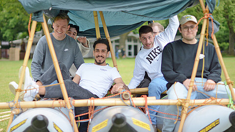 Apprentice team on a self-made raft