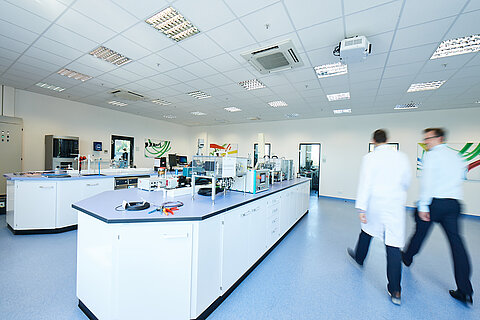 Two employees going through the test lab