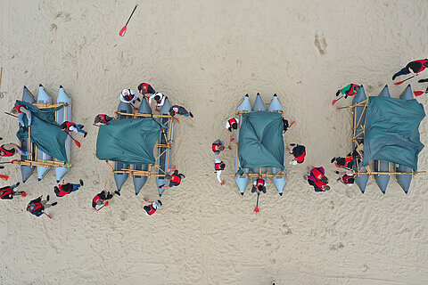 The four rafts of the apprentices on the beach, seen from the air 